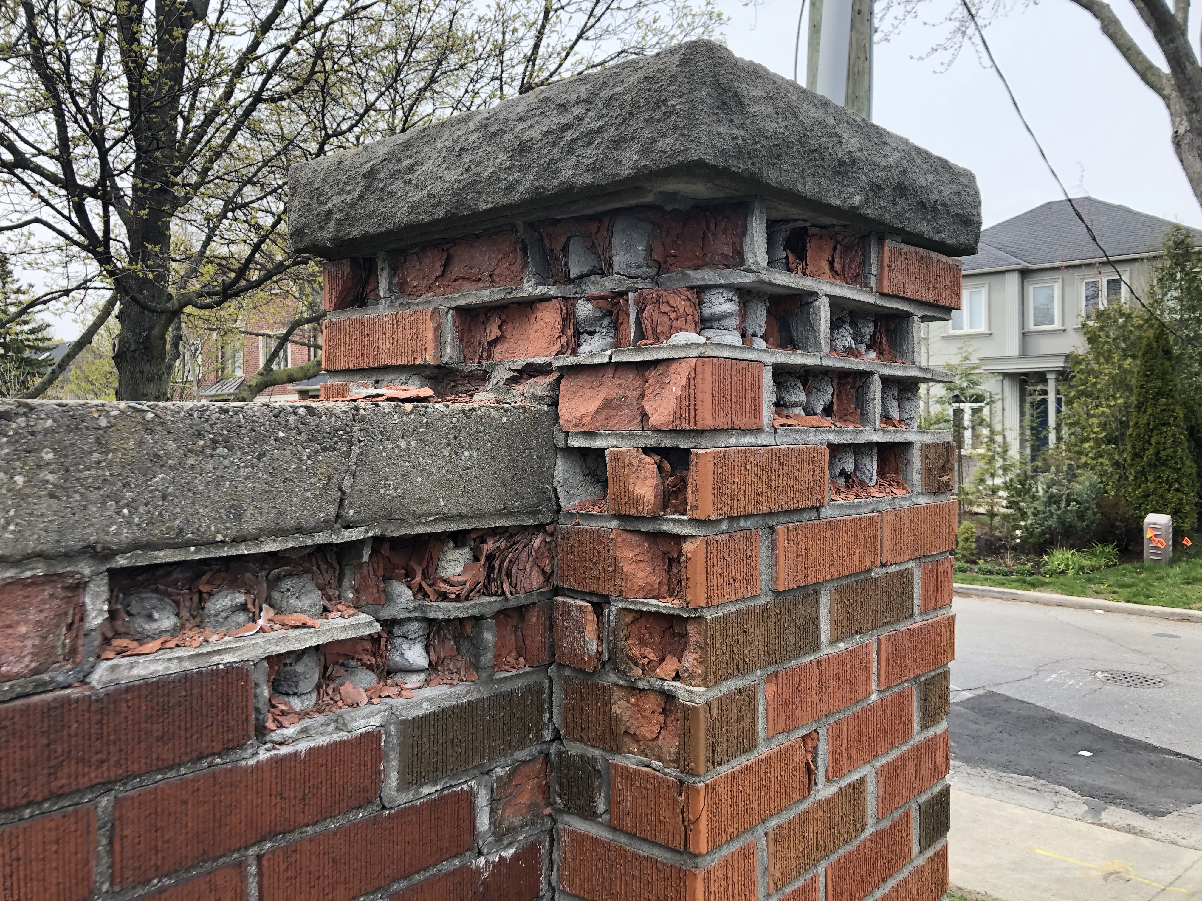 Hard mortar has destroyed the brick on this pillar