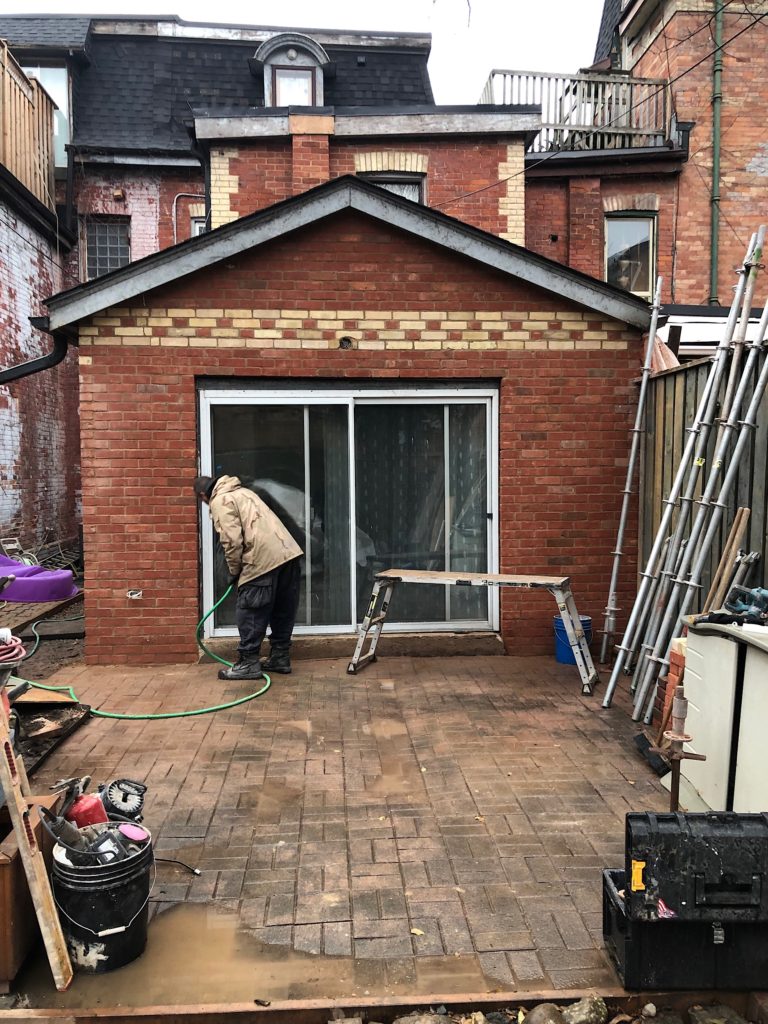 A red brick wall on a victorian rowhouse. The flemish bond detail has been restored.