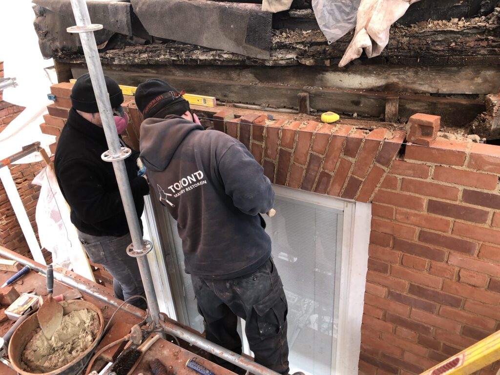 The crew finishing off a jack arch at the rear of the building