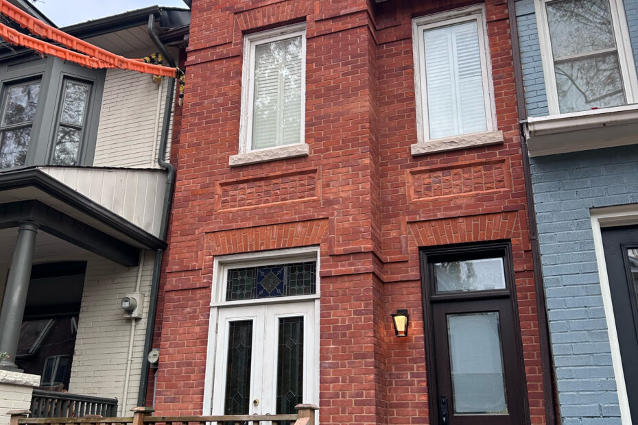 Victorian brick facade restoration project in Toronto showing rebuilt heritage brickwork.